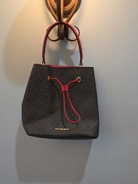 Michael Kors Brown Monogram Bucket Bag with Red Trim